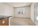 Well-lit dining area with large windows providing natural light, with modern door and table space at 111 Henley St, Canton, GA 30114