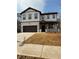 Two-story house with a brown front door and attached garage at 111 Henley St, Canton, GA 30114