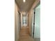 Long hallway with light walls and wood-look flooring at 111 Henley St, Canton, GA 30114