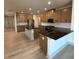 Modern kitchen with dark countertops and wood cabinets at 111 Henley St, Canton, GA 30114