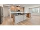 Kitchen island features a dark countertop with a brass faucet, adding a touch of luxury to this modern space at 111 Henley St, Canton, GA 30114