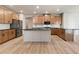 Spacious kitchen with stainless steel appliances, white subway tile backsplash, black countertops and ample cabinet space at 111 Henley St, Canton, GA 30114