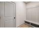 Clean mudroom with built-in shelving and coat hooks near an exterior door at 111 Henley St, Canton, GA 30114