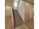 Elegant staircase with wood railings and flooring at 111 Henley St, Canton, GA 30114