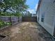 Fenced backyard with mature trees along the side and back property lines at 500 Mica Trce, South Fulton, GA 30349