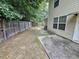 Fenced backyard with a patio area and mature trees, providing privacy at 500 Mica Trce, South Fulton, GA 30349