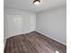 This bedroom offers wood floors, closet, and a white door at 500 Mica Trce, South Fulton, GA 30349