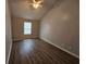 Bedroom with ceiling fan, natural light, and wood floors at 500 Mica Trce, South Fulton, GA 30349