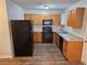 Modern kitchen with stainless steel appliances, countertops, and wood cabinets at 500 Mica Trce, South Fulton, GA 30349