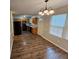 Open floor plan with kitchen features new appliances and wood-look flooring at 500 Mica Trce, South Fulton, GA 30349
