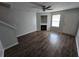 View of the living room with a fireplace and wood-look flooring at 500 Mica Trce, South Fulton, GA 30349
