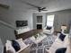Cozy living room features stylish furniture, a fireplace, and wood-look flooring at 500 Mica Trce, South Fulton, GA 30349