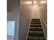 The stairs leading to the upper floor are carpeted at 500 Mica Trce, South Fulton, GA 30349