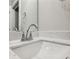 Bathroom vanity features a large mirror and a sink at 1095 Tucker Ave # 401, Atlanta, GA 30310