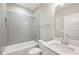 Bright bathroom with white vanity, subway tile shower, and modern fixtures at 1095 Tucker Ave # 401, Atlanta, GA 30310
