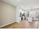 Modern kitchen with white cabinets, stainless steel appliances, granite counters and wood flooring at 1095 Tucker Ave # 401, Atlanta, GA 30310