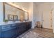 Bathroom with double vanity, large mirror, and dark brown cabinets at 91 Pinewood Dr, Covington, GA 30014