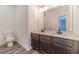 Bathroom with double vanity and dark brown cabinets at 91 Pinewood Dr, Covington, GA 30014