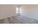 Simple bedroom with a window and gray carpeting at 91 Pinewood Dr, Covington, GA 30014