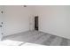 Spacious bedroom with carpet and access to hallway at 91 Pinewood Dr, Covington, GA 30014