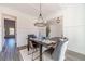 Spacious dining room with chandelier, and view of kitchen at 91 Pinewood Dr, Covington, GA 30014