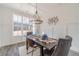 Formal dining room with a chandelier, wood floors, and wainscoting at 91 Pinewood Dr, Covington, GA 30014