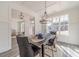 Bright dining room with a large window and a view to the kitchen and entryway at 91 Pinewood Dr, Covington, GA 30014