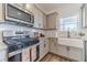 Modern kitchen featuring stainless steel appliances and white farmhouse sink at 91 Pinewood Dr, Covington, GA 30014