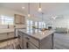 Granite kitchen island with seating overlooking living room at 91 Pinewood Dr, Covington, GA 30014