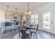 Eat-in kitchen with gray cabinets and a view to backyard at 91 Pinewood Dr, Covington, GA 30014