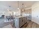 Modern kitchen with gray cabinets and granite countertops at 91 Pinewood Dr, Covington, GA 30014