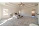 Main bedroom with carpet, tray ceiling, and access to en-suite bathroom at 91 Pinewood Dr, Covington, GA 30014