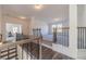 Open and bright upstairs hallway with a view of the main bedroom at 91 Pinewood Dr, Covington, GA 30014