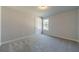 Simple bedroom with grey carpet and neutral walls at 125 Pinewood Dr, Covington, GA 30014