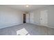 Well-lit bedroom with grey carpet and neutral walls at 125 Pinewood Dr, Covington, GA 30014