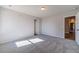 Bright bedroom featuring grey carpet and an open floor plan at 125 Pinewood Dr, Covington, GA 30014