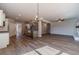 Bright dining area with hardwood floors and chandelier, kitchen view at 125 Pinewood Dr, Covington, GA 30014