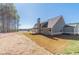 Rear view of a two story house, showcasing a large backyard at 125 Pinewood Dr, Covington, GA 30014