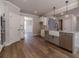 Modern kitchen with island, farmhouse sink, and stainless steel appliances at 125 Pinewood Dr, Covington, GA 30014