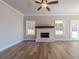 Living area with hardwood floors, fireplace and access to backyard at 125 Pinewood Dr, Covington, GA 30014