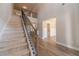 Elegant staircase with wrought iron railing at 125 Pinewood Dr, Covington, GA 30014