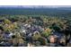 Stunning aerial view of a neighborhood nestled among lush trees with the city skyline in the distance at 3621 Vinings Slope Se # 3202, Atlanta, GA 30339