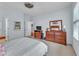 Bright bedroom with a ceiling fan, dresser, and closet offering ample storage space at 3621 Vinings Slope Se # 3202, Atlanta, GA 30339