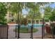 Serene community pool area with lush landscaping and comfortable lounge seating at 3621 Vinings Slope Se # 3202, Atlanta, GA 30339