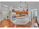 Open kitchen with hardwood floors, granite countertops, stainless steel appliances, and lots of light at 3621 Vinings Slope Se # 3202, Atlanta, GA 30339