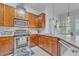 Modern kitchen with stainless steel appliances, granite countertops, and ample cabinet space at 3621 Vinings Slope Se # 3202, Atlanta, GA 30339