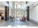 Elegant lobby with high ceilings, fireplace, and comfortable seating area at 3621 Vinings Slope Se # 3202, Atlanta, GA 30339