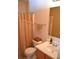 Cozy bathroom with neutral tones, vanity, toilet and shower with decorative curtain at 1007 Sycamore Ln, Villa Rica, GA 30180