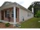 Charming home exterior featuring a brick facade, vinyl siding, and landscaped yard at 1007 Sycamore Ln, Villa Rica, GA 30180