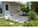 Inviting outdoor patio featuring a concrete slab, seating, and lush landscaping at 1007 Sycamore Ln, Villa Rica, GA 30180